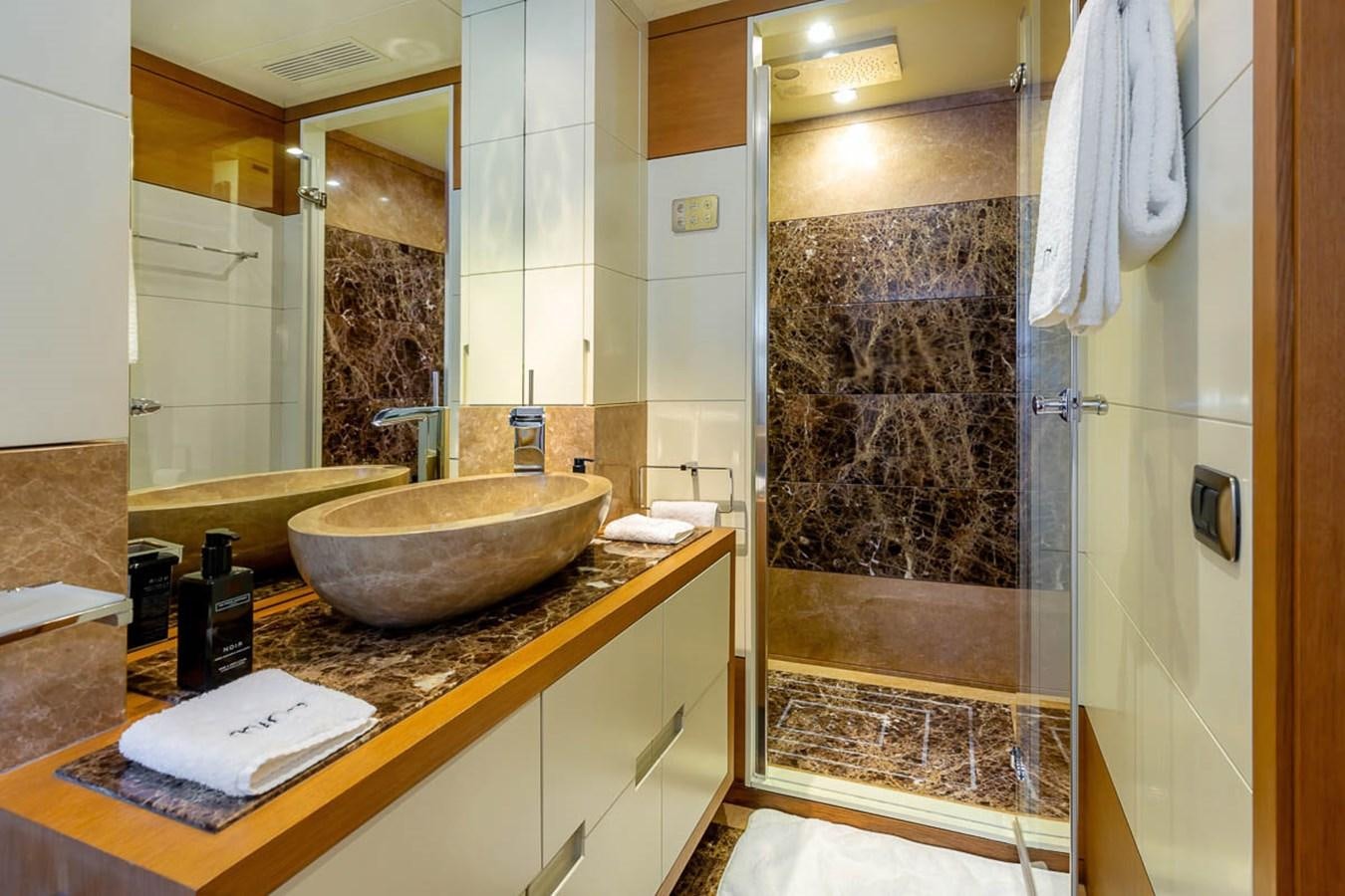 a bathroom with a sink and a mirror aboard MINA Yacht for Sale