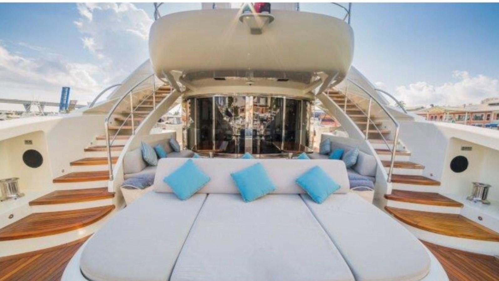 a large space ship with blue pillows aboard MY HAPPY HOUR Yacht for Sale