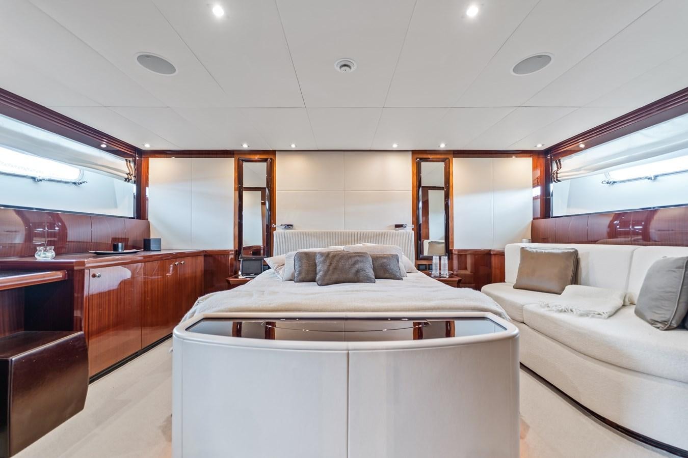 a room with a bed and a couch aboard MY HAPPY HOUR Yacht for Sale