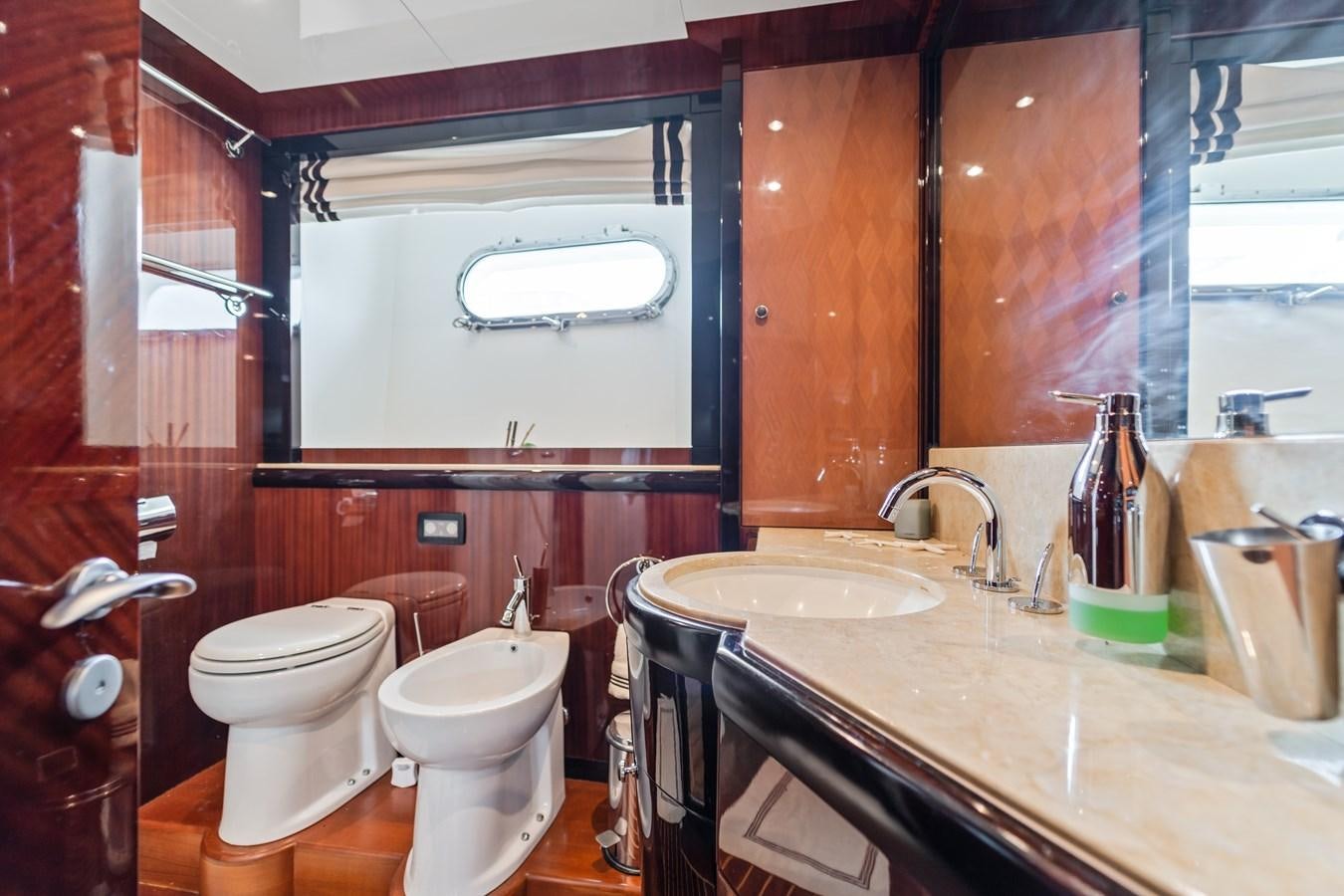 a bathroom with a sink toilet and a bathtub aboard MY HAPPY HOUR Yacht for Sale