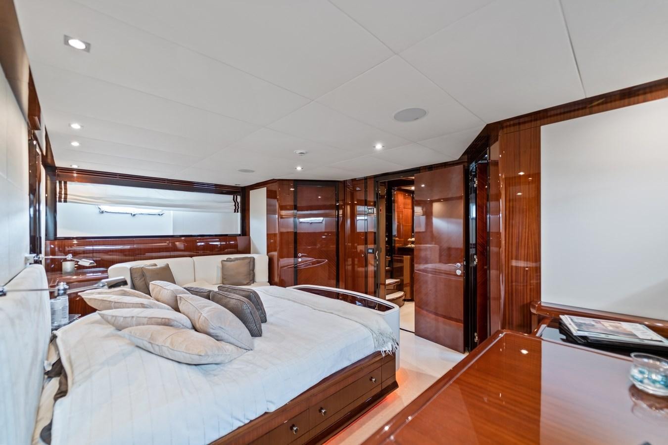 a room with a bed and a desk aboard MY HAPPY HOUR Yacht for Sale