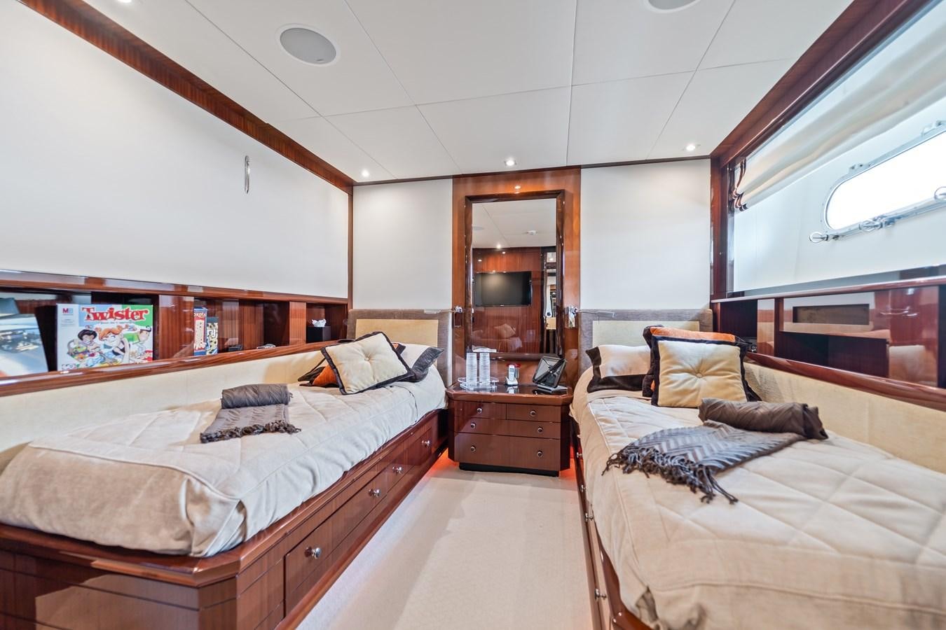 a bedroom with two beds aboard MY HAPPY HOUR Yacht for Sale