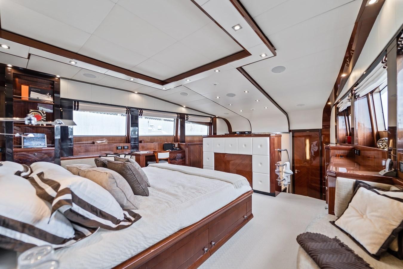 a bedroom with a large bed aboard MY HAPPY HOUR Yacht for Sale
