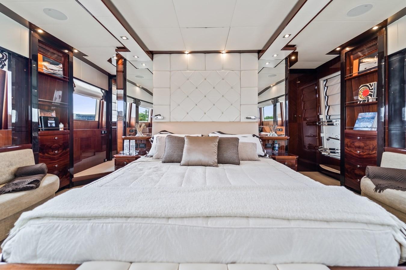 a bed in a room aboard MY HAPPY HOUR Yacht for Sale