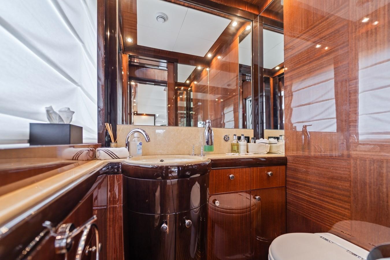 a bathroom with a sink and cabinets aboard MY HAPPY HOUR Yacht for Sale