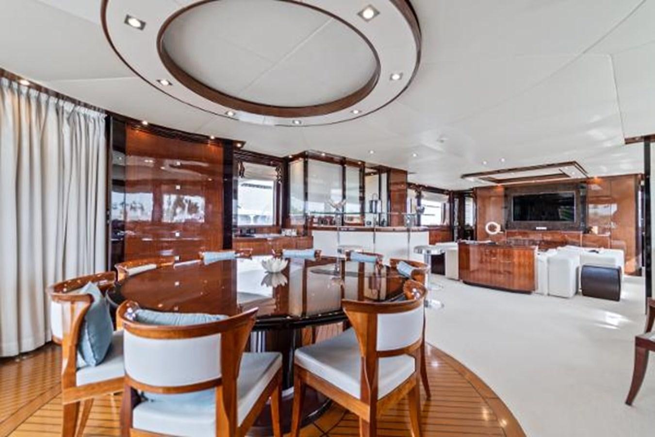 a large kitchen with a dining table aboard MY HAPPY HOUR Yacht for Sale