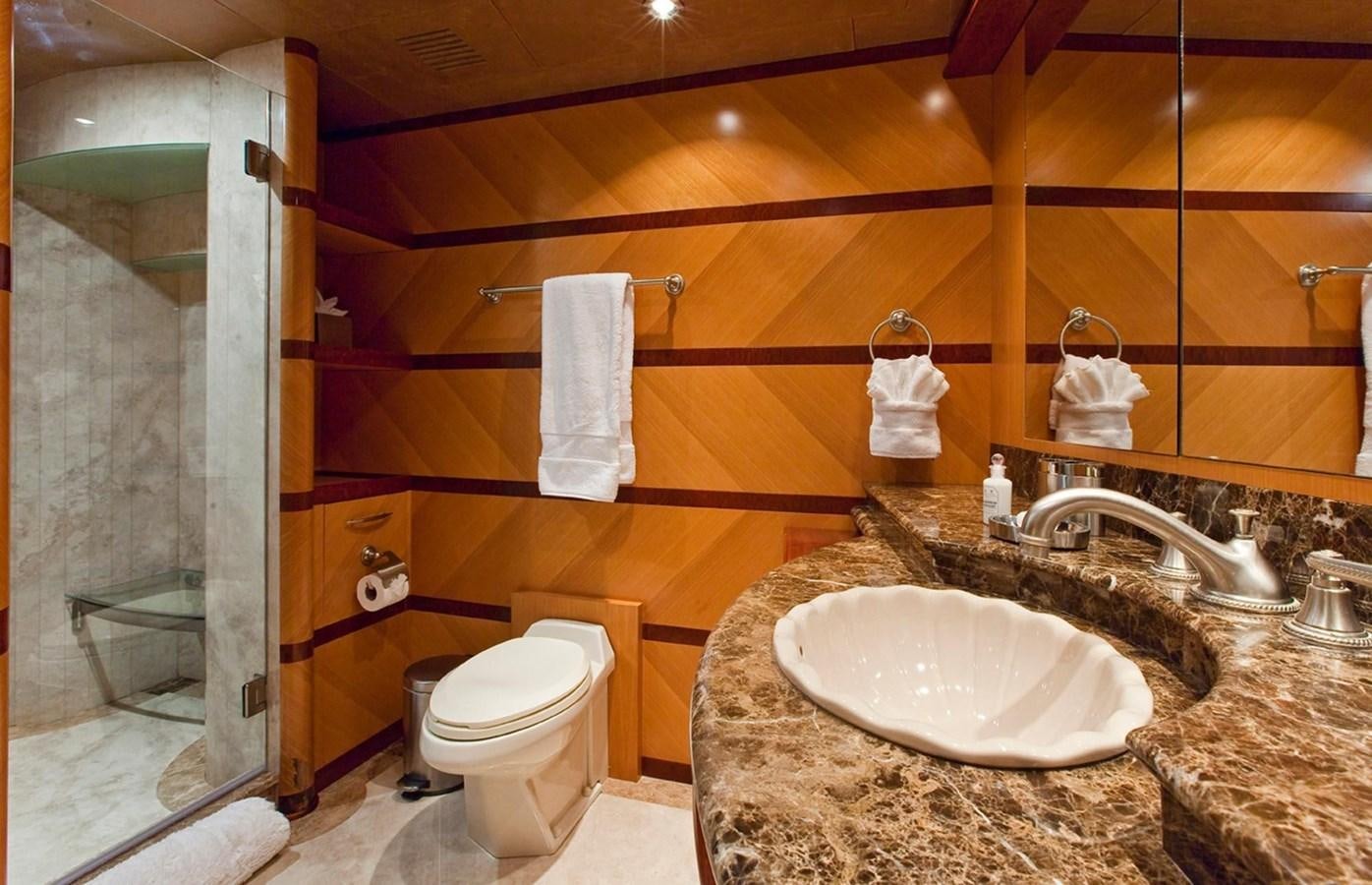 a bathroom with a marble countertop aboard NO NAME  2002 120 TRI-DECK M/Y Yacht for Sale