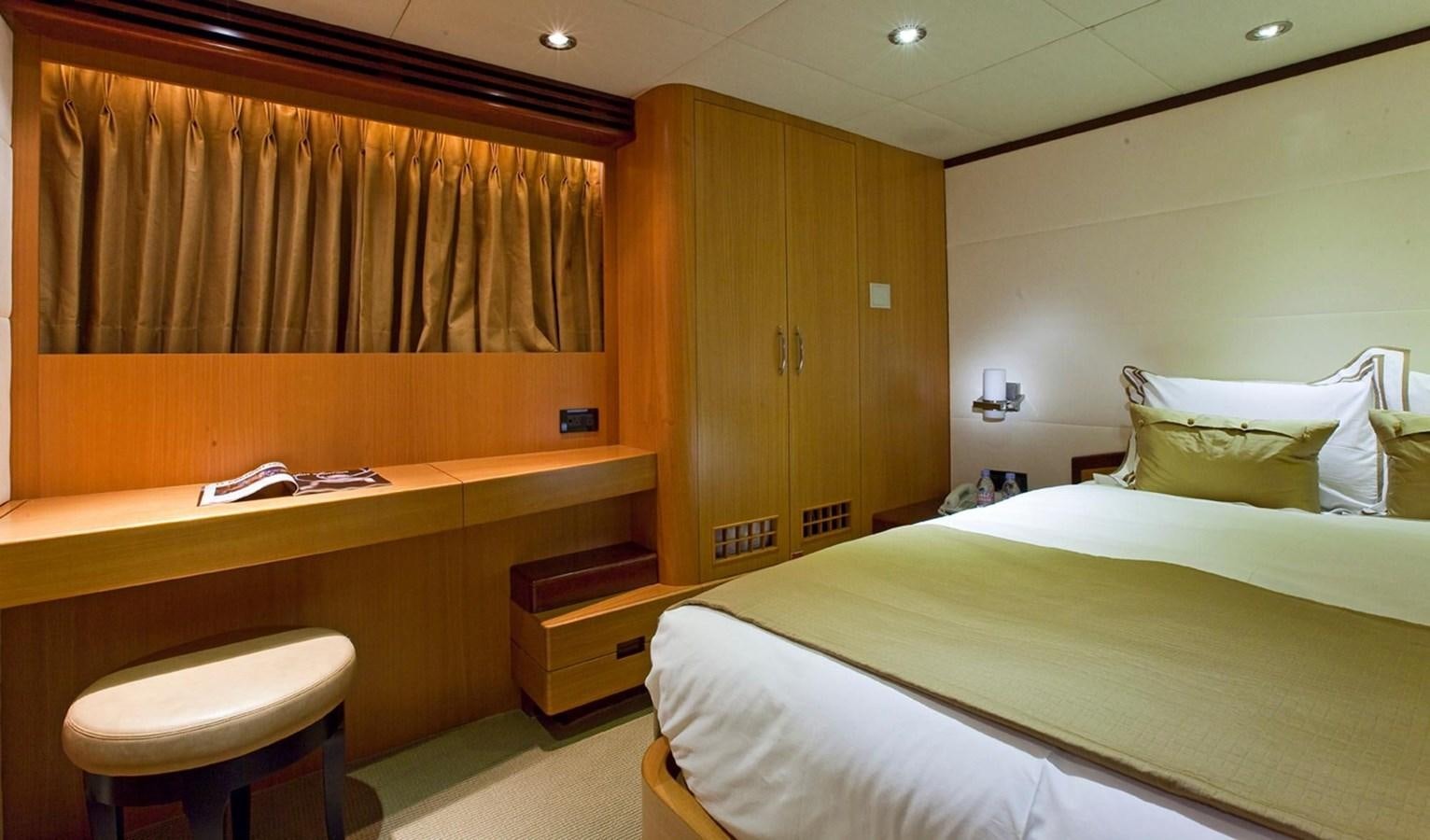 a room with a desk and a bed aboard NO NAME  2002 120 TRI-DECK M/Y Yacht for Sale