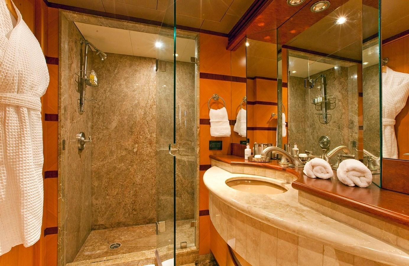 a bathroom with a glass shower aboard NO NAME  2002 120 TRI-DECK M/Y Yacht for Sale