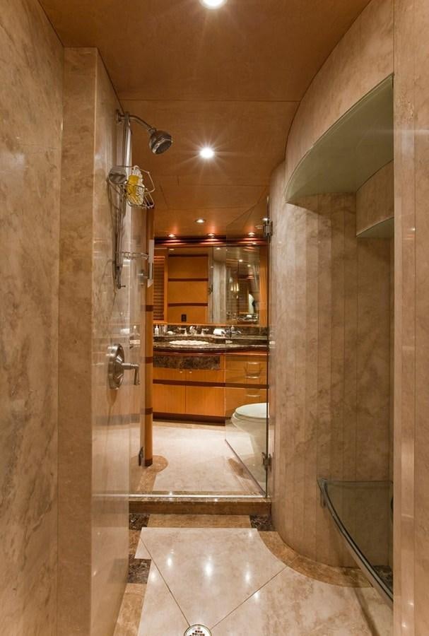 a bathroom with a large glass shower aboard NO NAME  2002 120 TRI-DECK M/Y Yacht for Sale