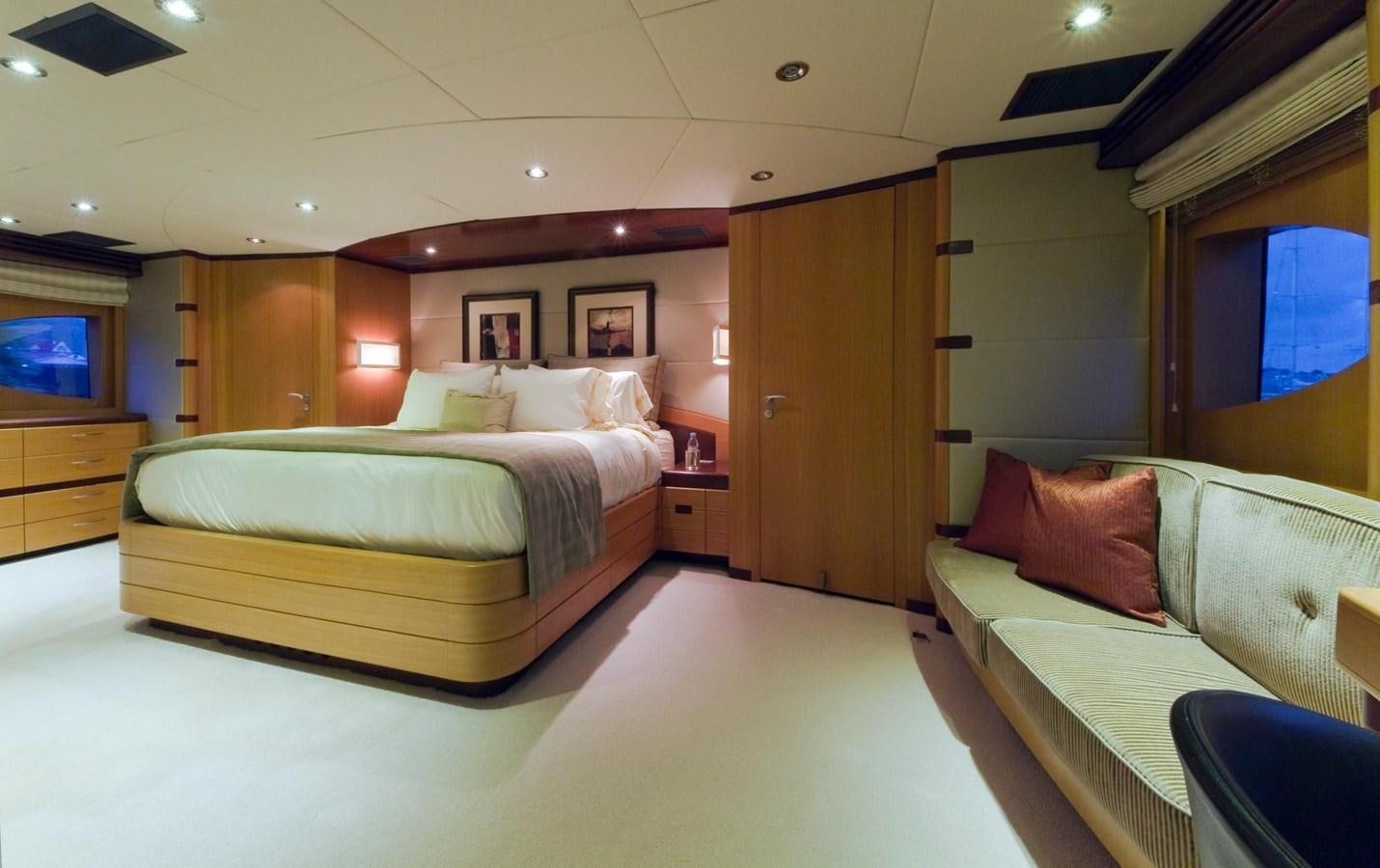 a room with a bed and a couch aboard NO NAME  2002 120 TRI-DECK M/Y Yacht for Sale