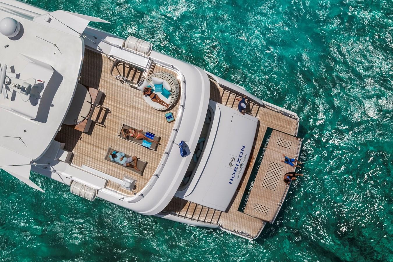 a group of people sitting in a circle on a boat aboard RP120 (NEW BOAT SPEC) Yacht for Sale