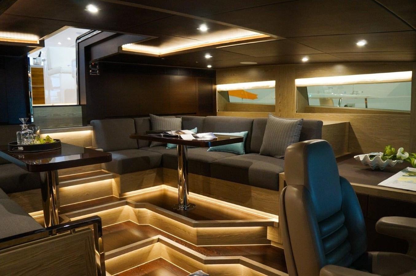 a room with a couch and a table aboard RP120 (NEW BOAT SPEC) Yacht for Sale