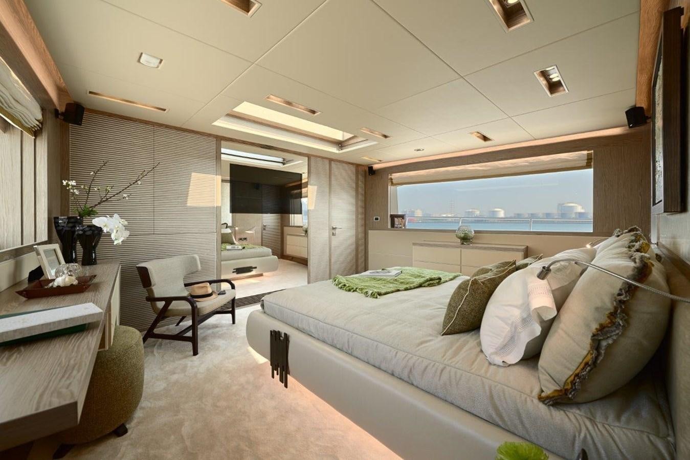 a bedroom with a bed and a desk aboard RP120 (NEW BOAT SPEC) Yacht for Sale