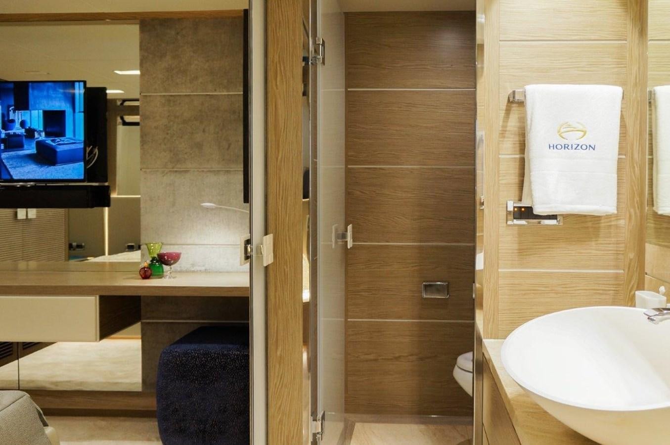 a bathroom with a wood door aboard RP120 (NEW BOAT SPEC) Yacht for Sale