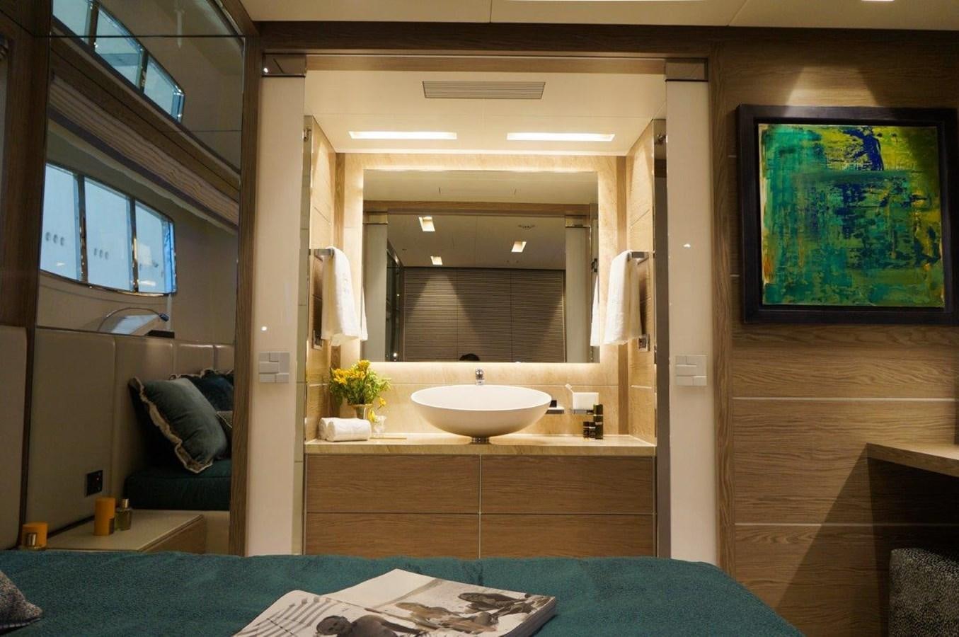 a bathroom with a sink and a mirror aboard RP120 (NEW BOAT SPEC) Yacht for Sale