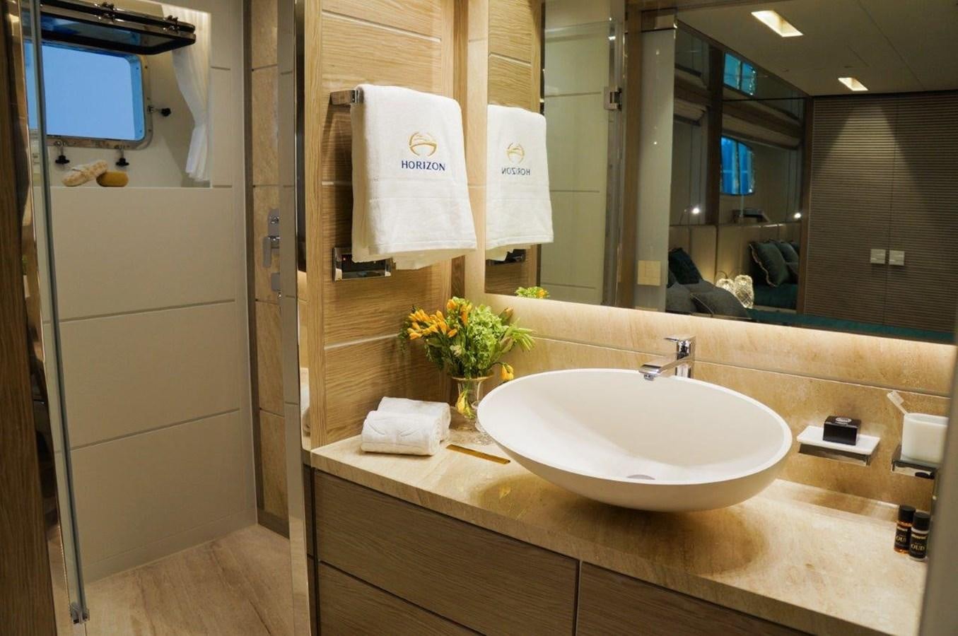 a bathroom with a sink and mirror aboard RP120 (NEW BOAT SPEC) Yacht for Sale