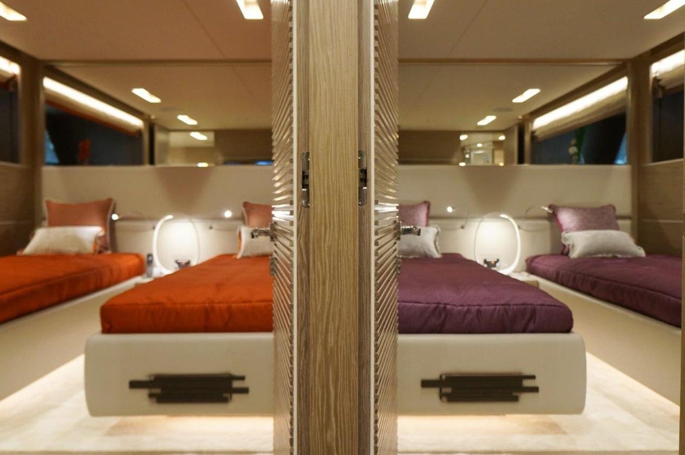 a room with a bed and a chair aboard RP120 (NEW BOAT SPEC) Yacht for Sale