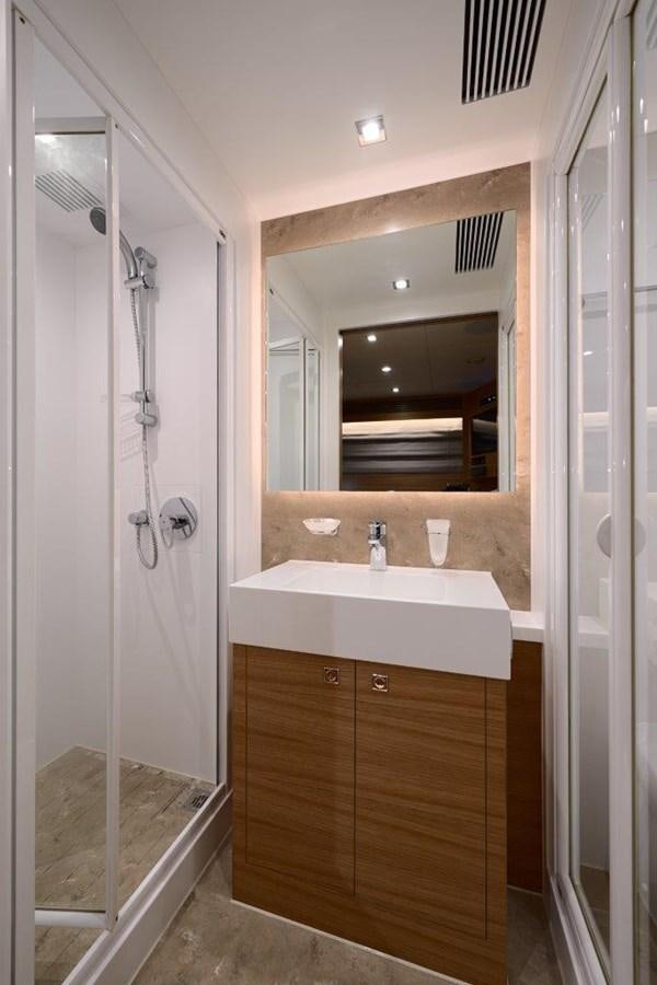 a bathroom with a tub sink and mirror aboard RP120 (NEW BOAT SPEC) Yacht for Sale