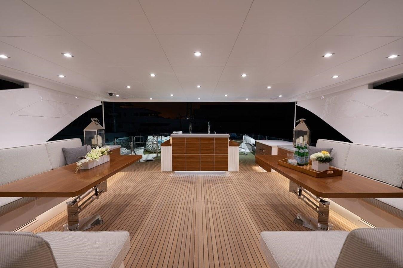 a room with a table and chairs aboard RP120 (NEW BOAT SPEC) Yacht for Sale