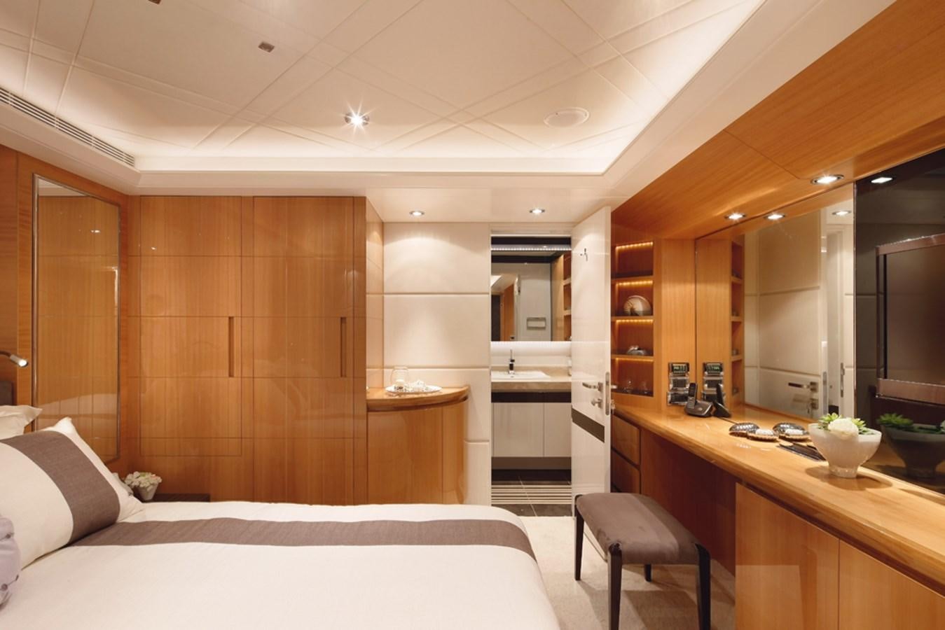 a modern bedroom with a large mirror aboard RP120 (NEW BOAT SPEC) Yacht for Sale