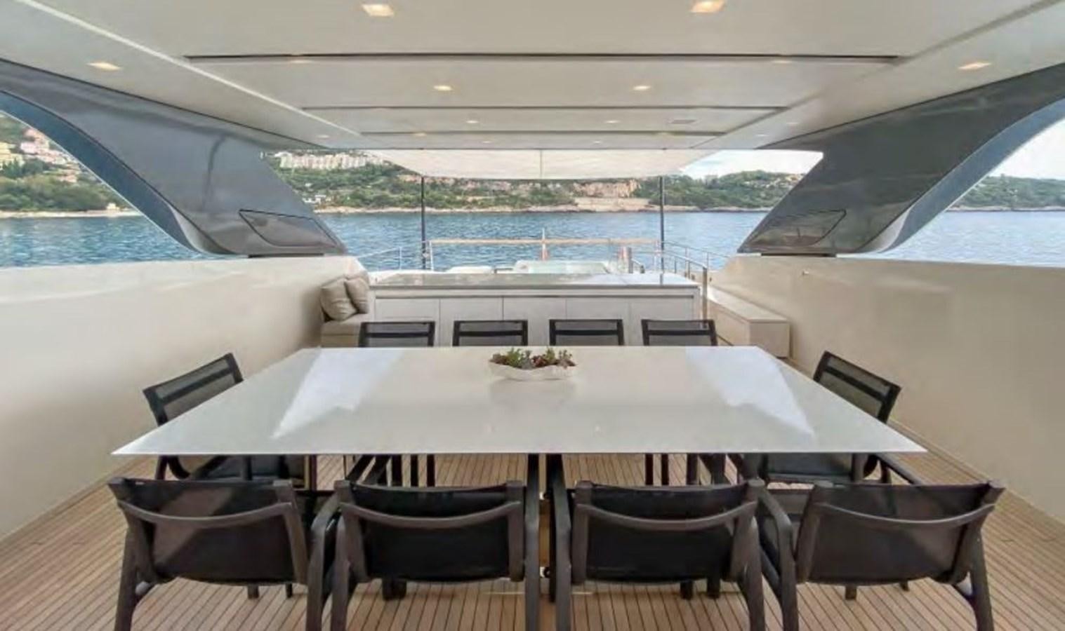 a table with chairs around it aboard CAIA S Yacht for Sale