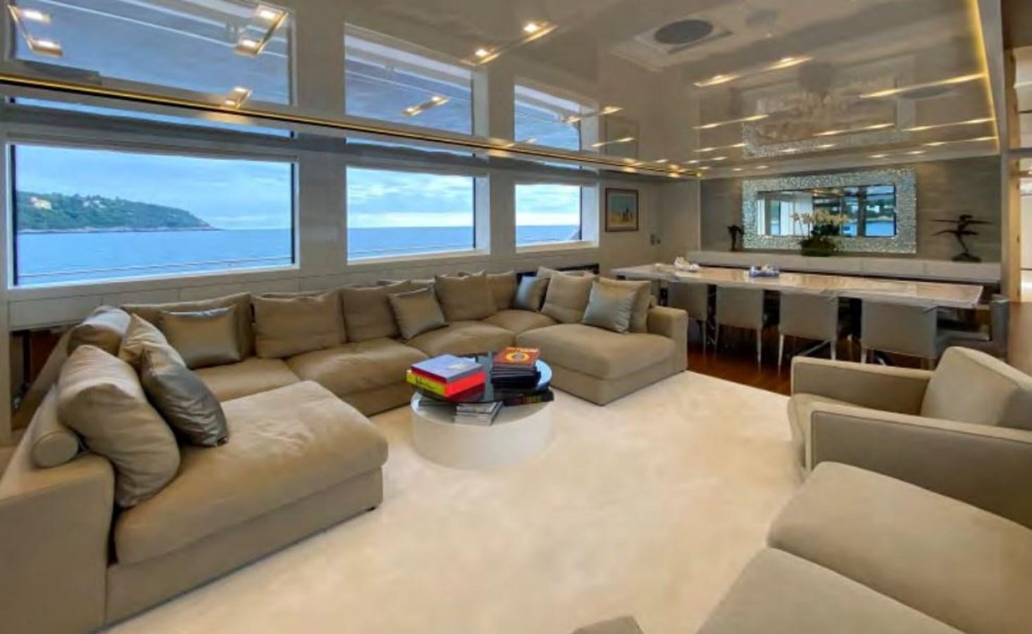 a large living room with a large window aboard CAIA S Yacht for Sale