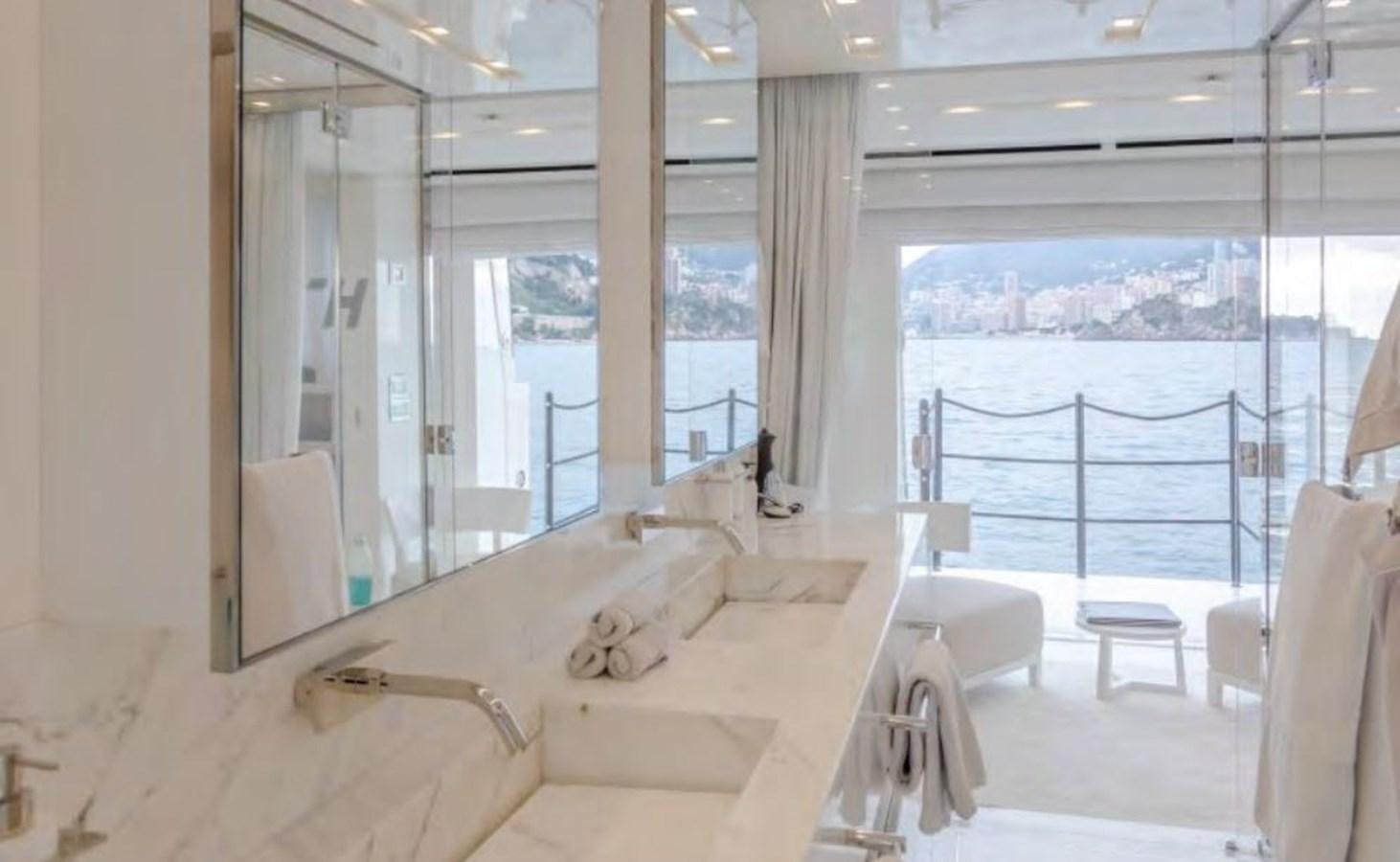 a room with a bed and a window aboard CAIA S Yacht for Sale