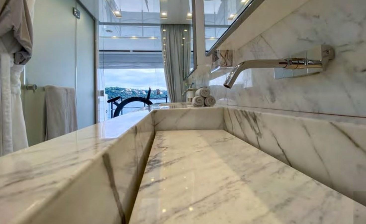 a large white bathtub with a cat on it aboard CAIA S Yacht for Sale