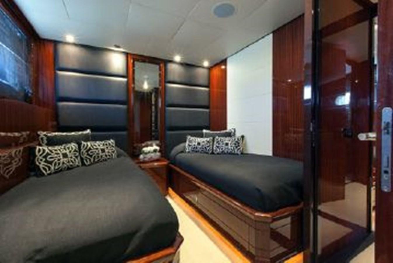 a room with a bed and a mirror aboard ISA 120 Yacht for Sale
