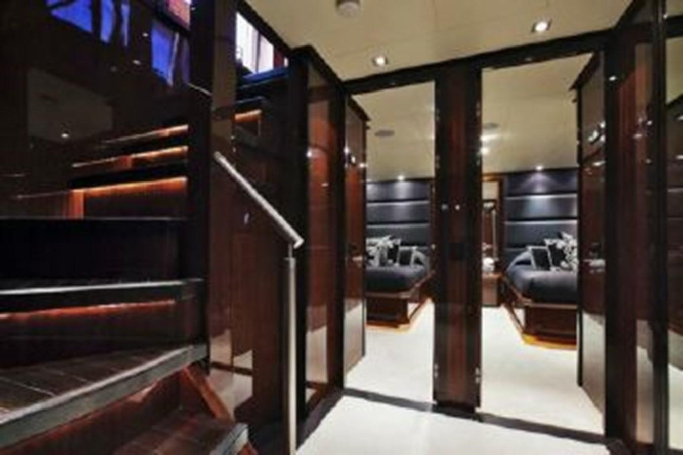 a room with a few doors aboard ISA 120 Yacht for Sale
