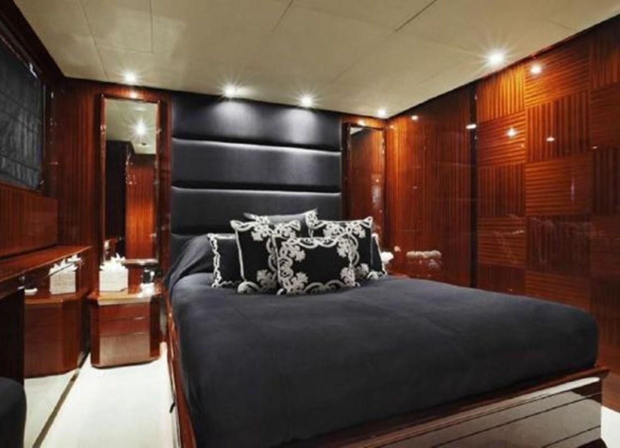 a bed in a room aboard ISA 120 Yacht for Sale