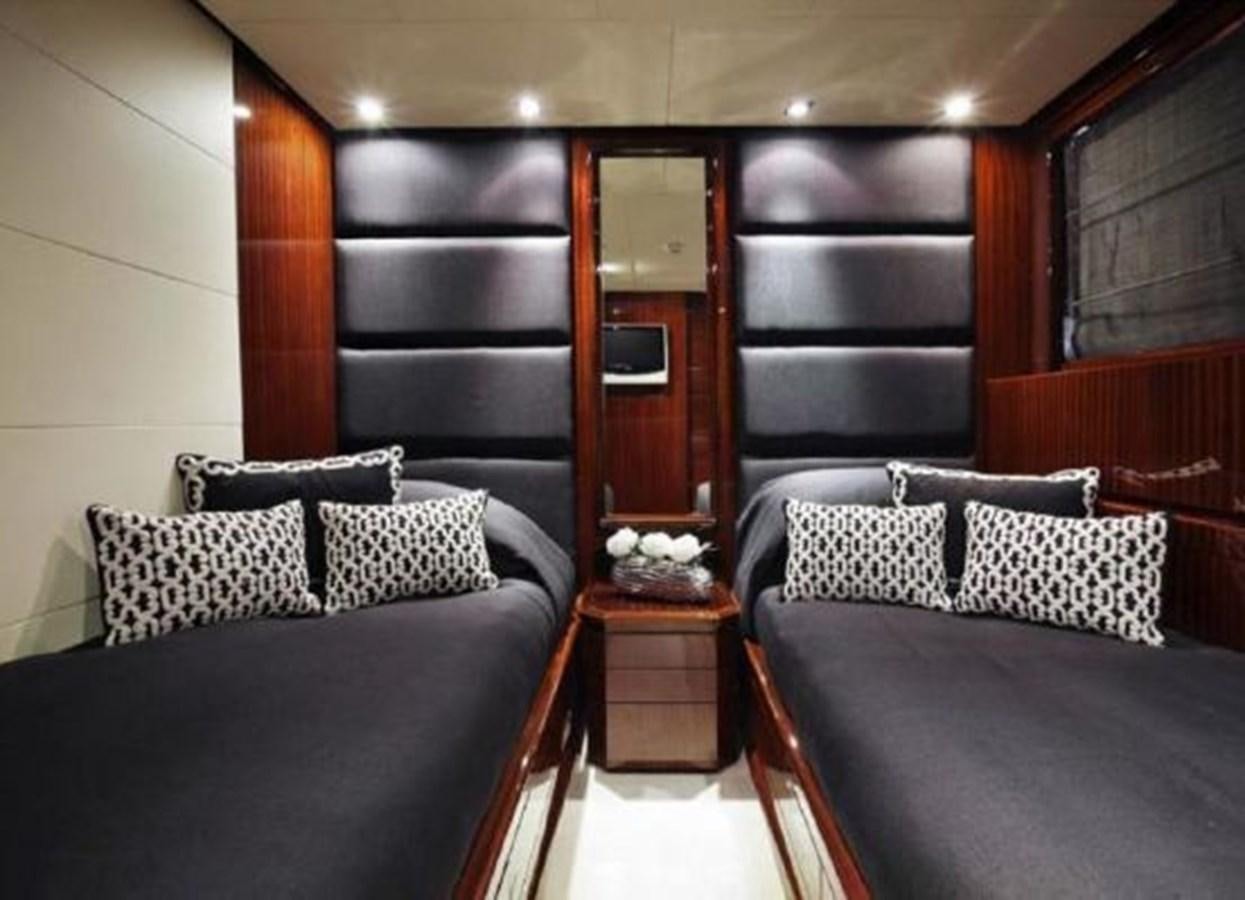 a room with a bed and a desk aboard ISA 120 Yacht for Sale
