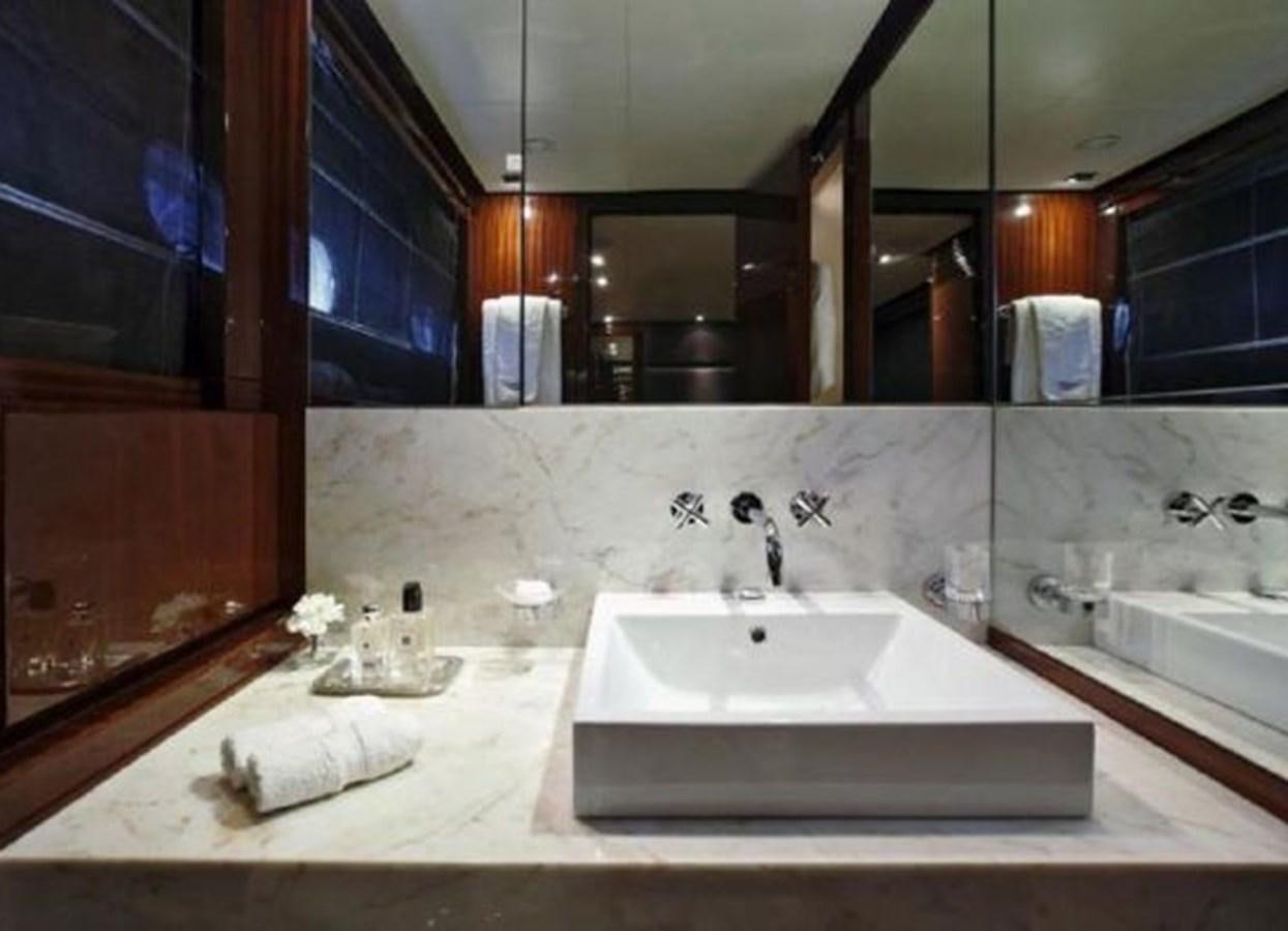 a bathroom with sinks and mirrors aboard ISA 120 Yacht for Sale