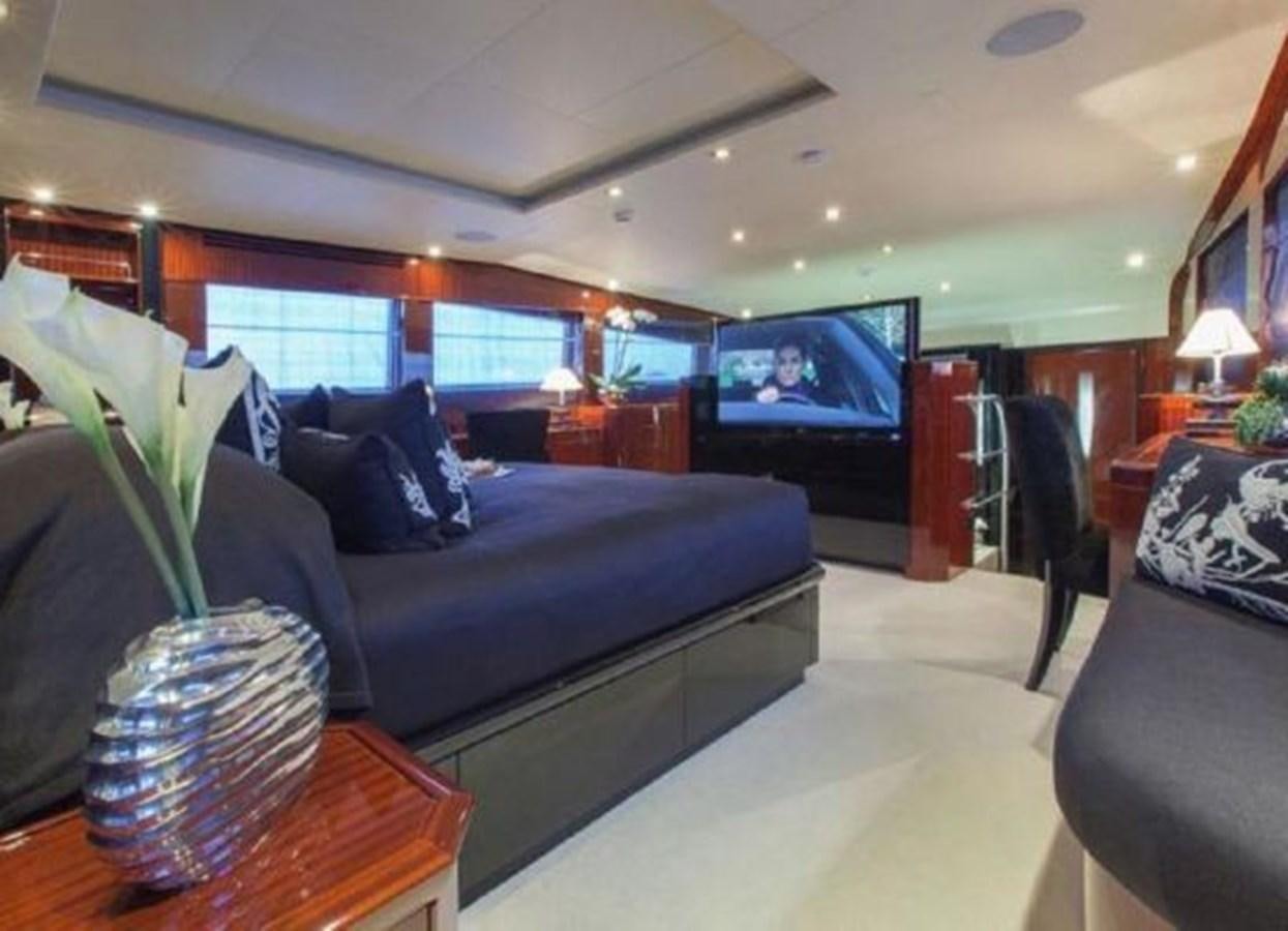 a living room with a couch and a television aboard ISA 120 Yacht for Sale