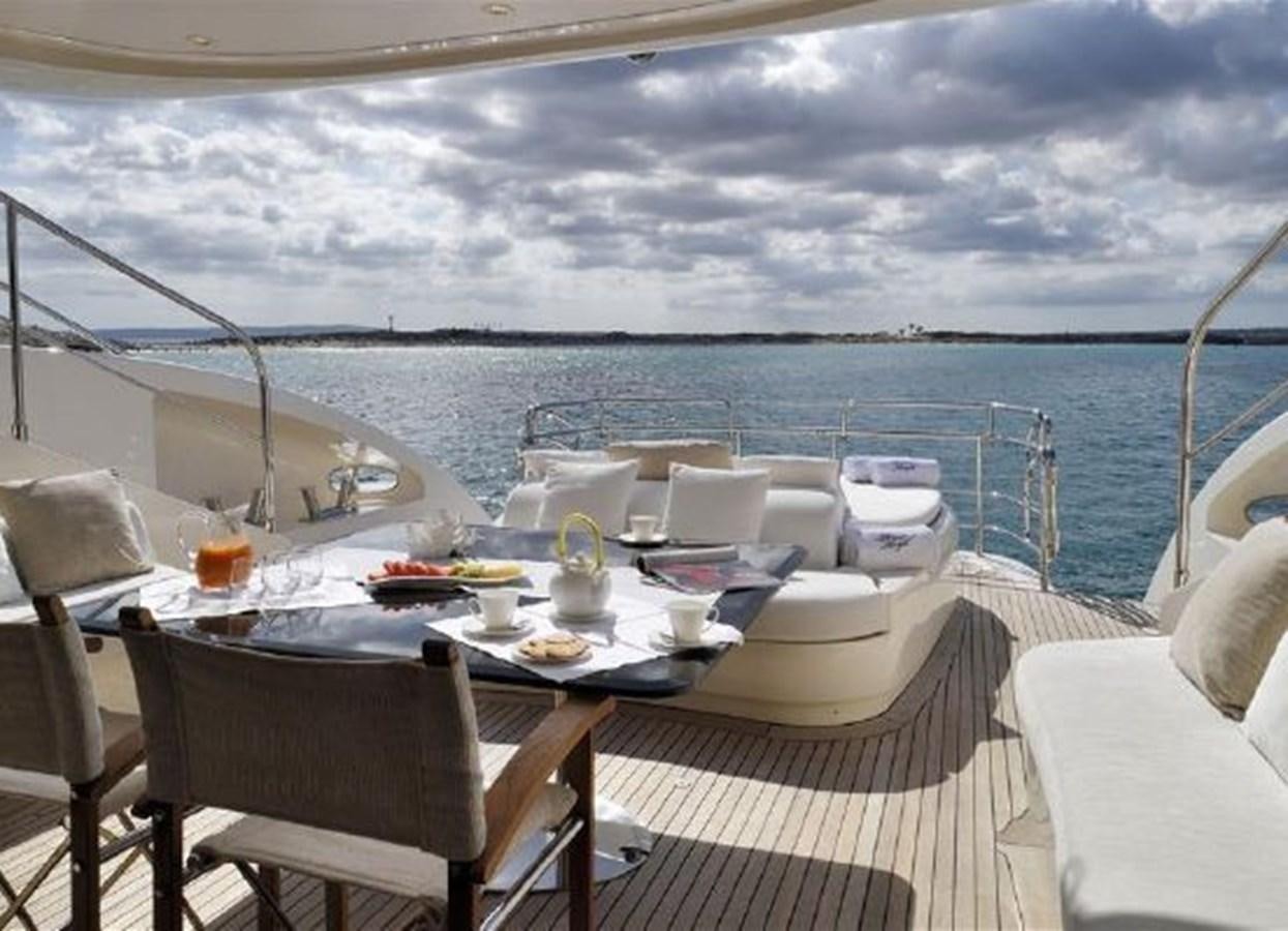 a table set for a meal on a boat aboard ISA 120 Yacht for Sale