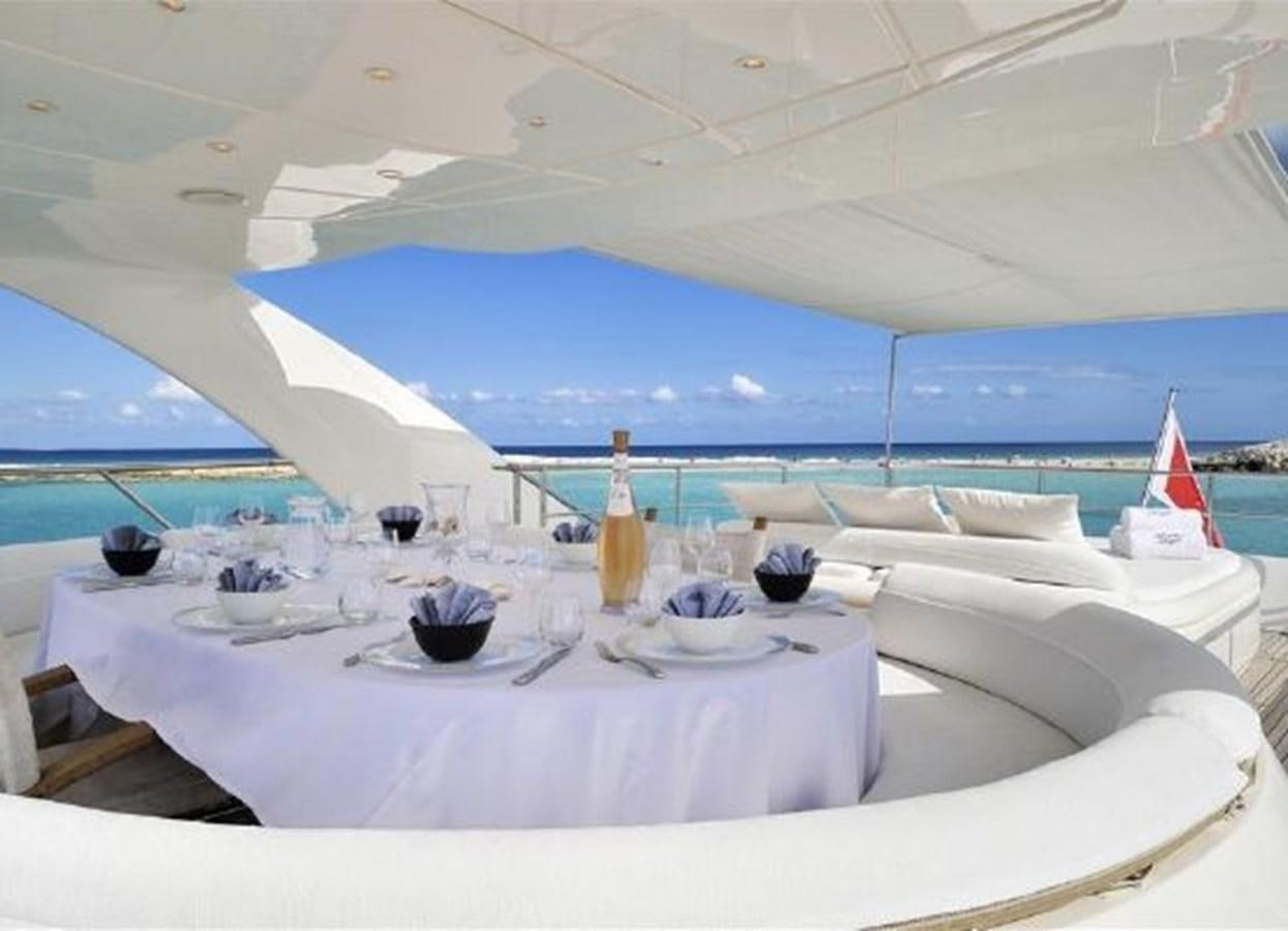 a table set for a dinner aboard ISA 120 Yacht for Sale