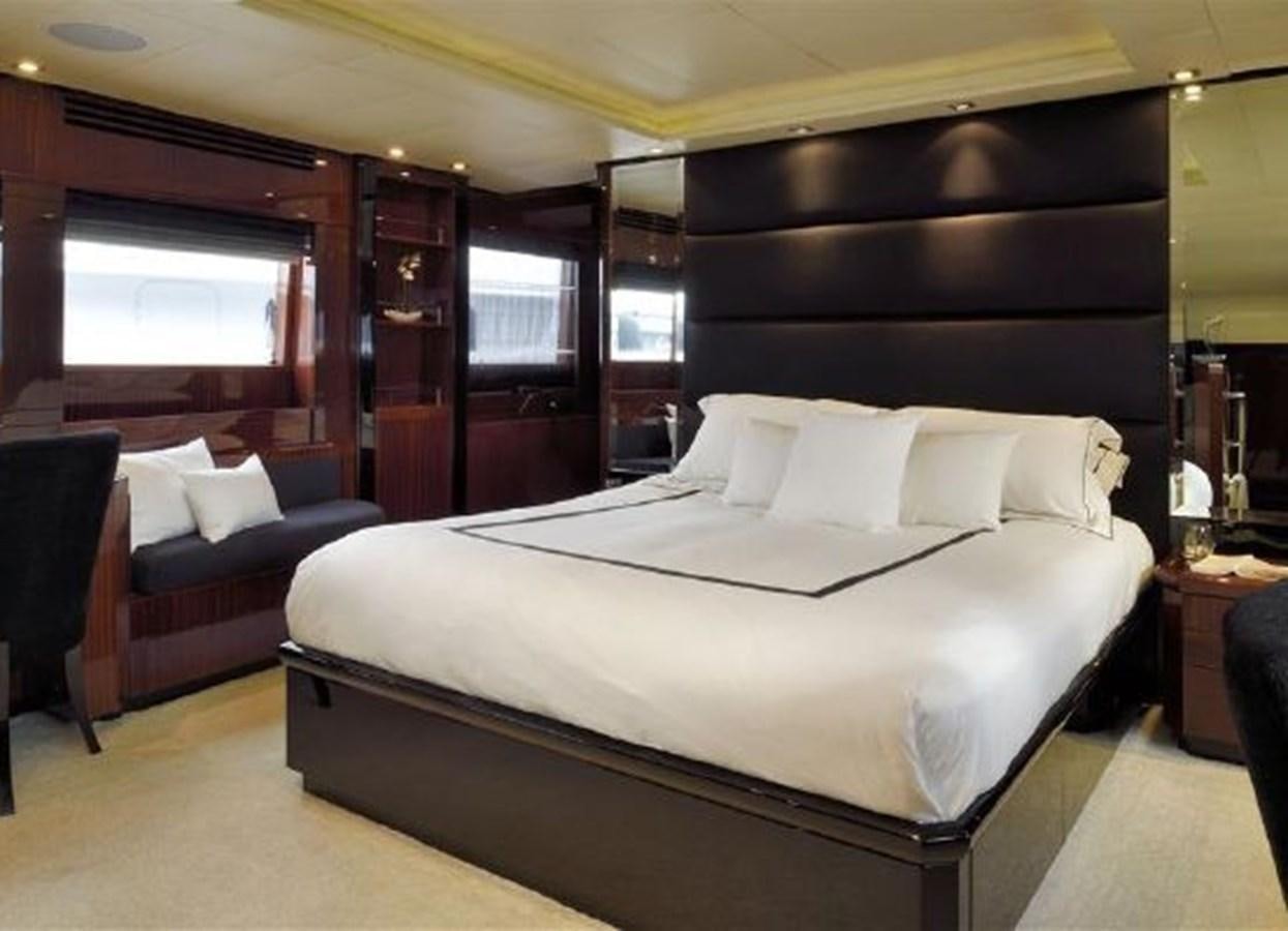 a bed in a room aboard ISA 120 Yacht for Sale