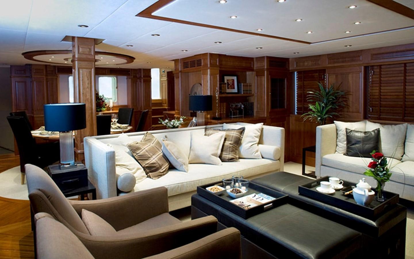 a living room with a white couch and a table aboard SUNNY HILL Yacht for Sale