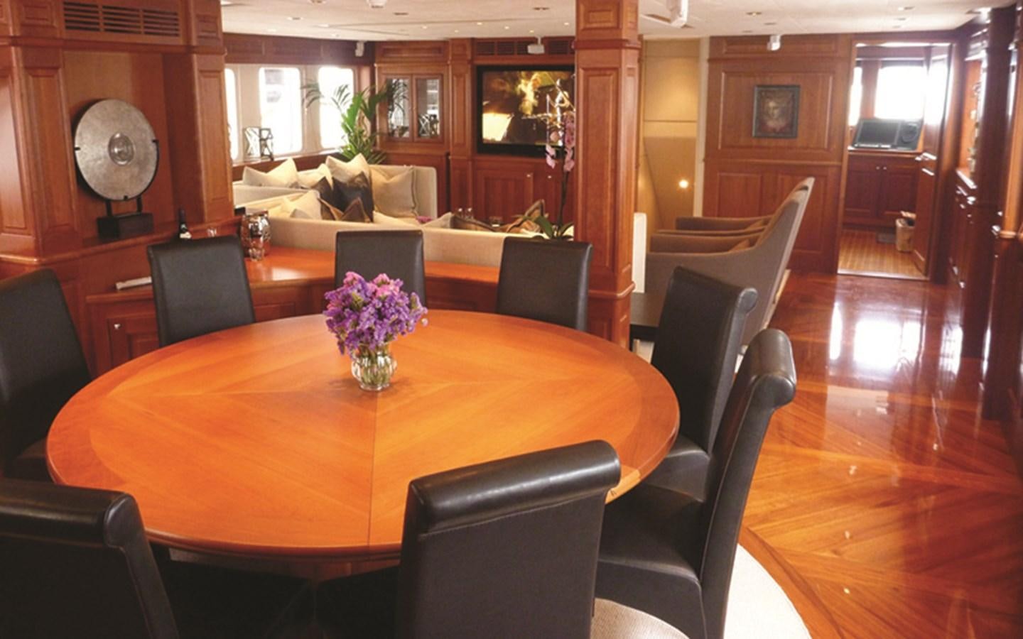 a dining room with a table and chairs aboard SUNNY HILL Yacht for Sale