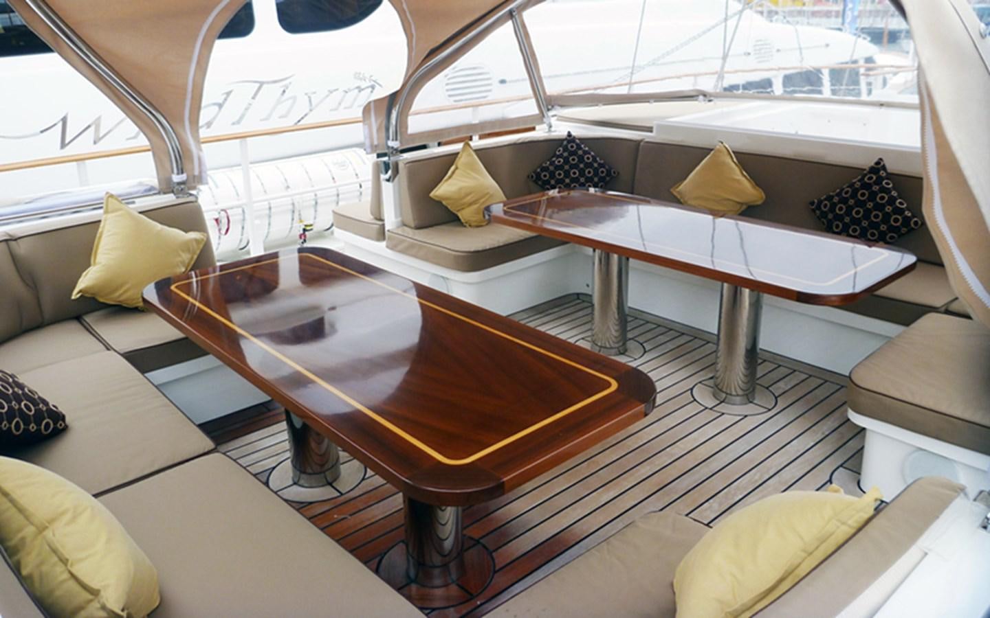 a room with a table and chairs aboard SUNNY HILL Yacht for Sale
