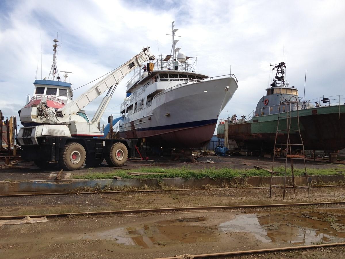 a couple of large boats on a dock aboard CALLISTO Yacht for Sale