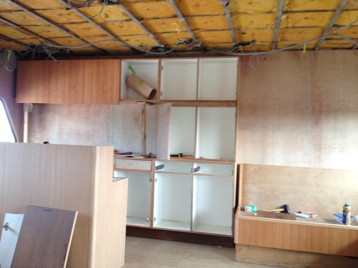 a room with wooden cabinets aboard CALLISTO Yacht for Sale