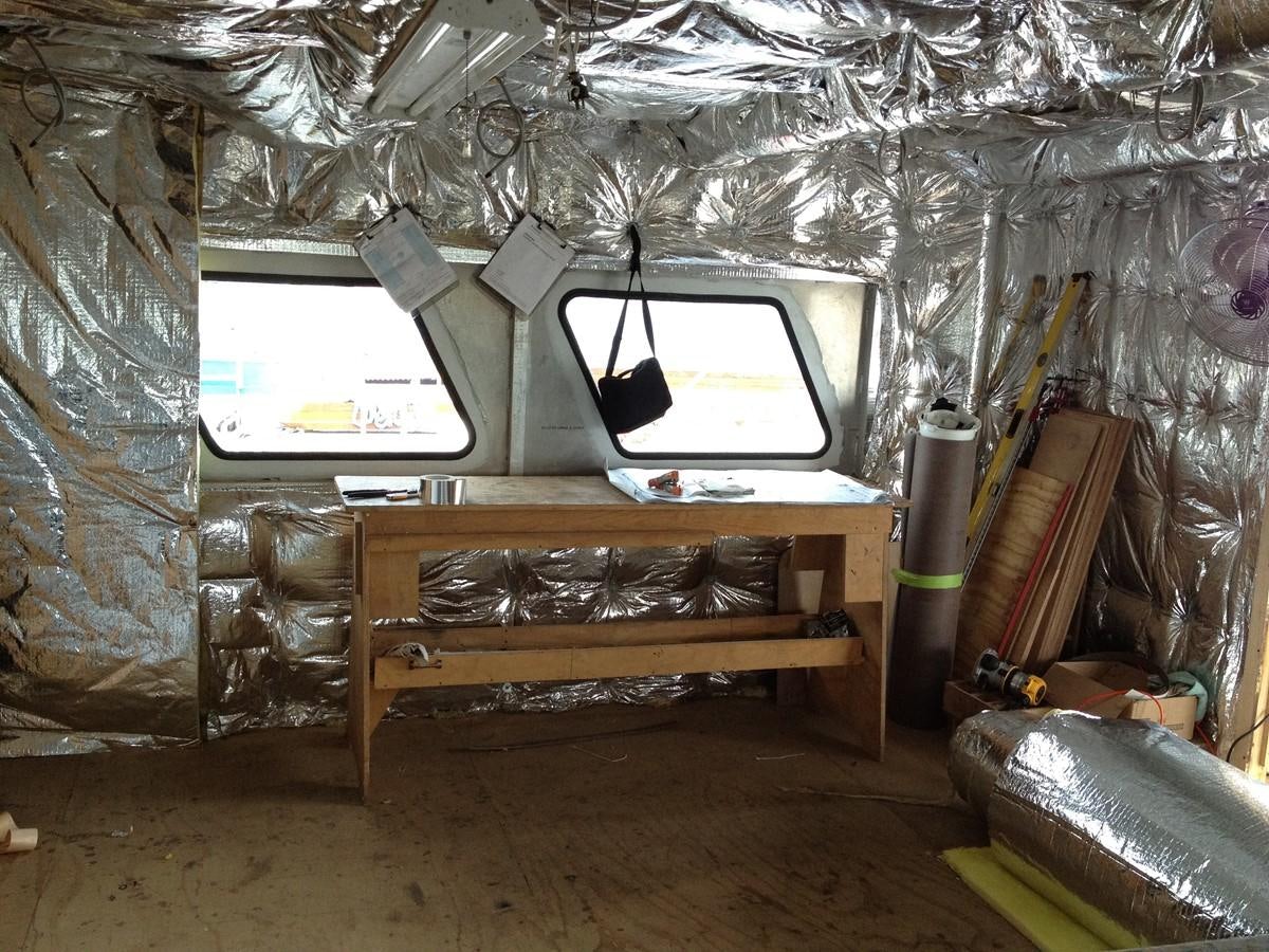 a room with a tv and a bed aboard CALLISTO Yacht for Sale