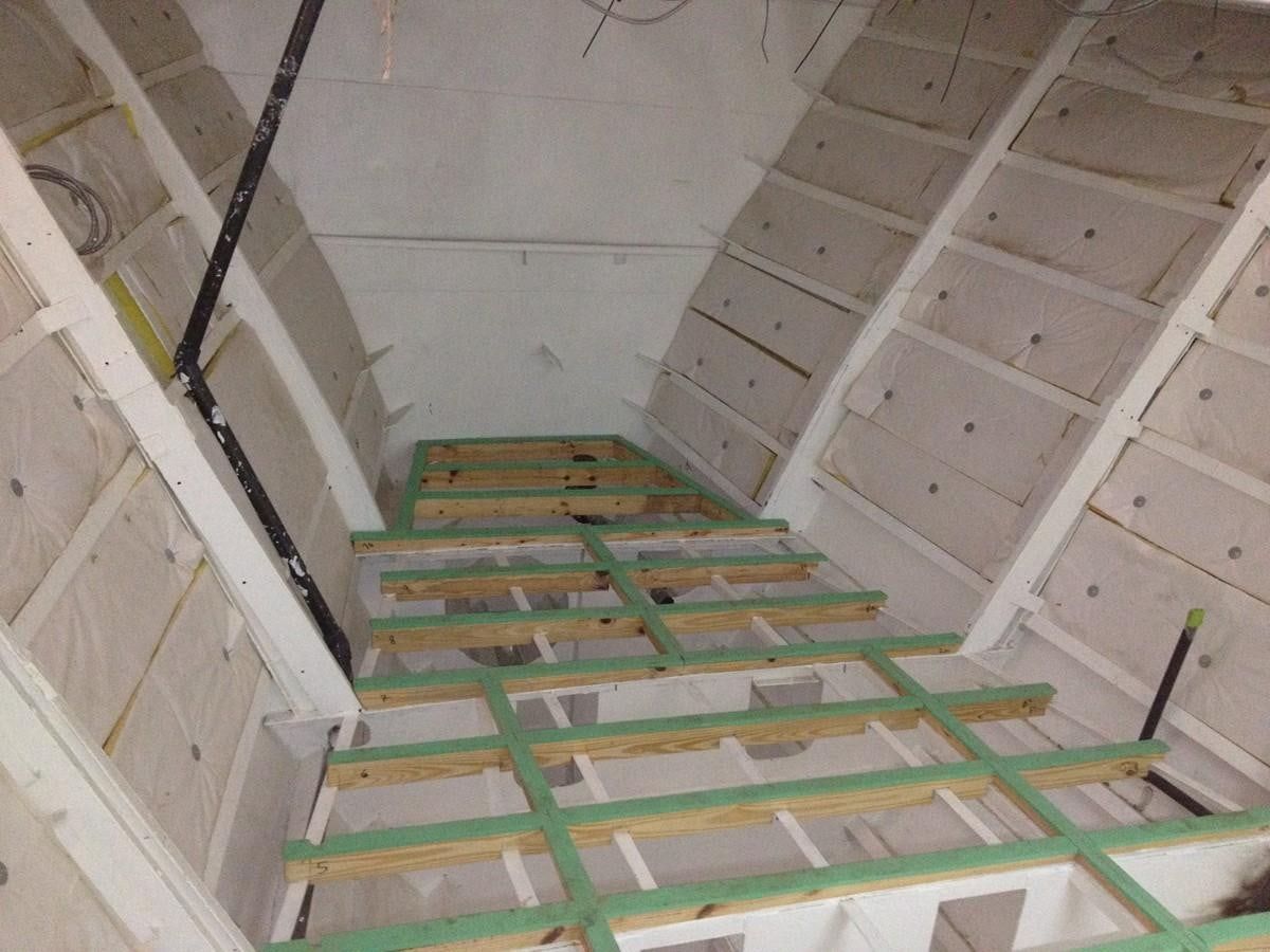 a pile of green and white striped stairs aboard CALLISTO Yacht for Sale