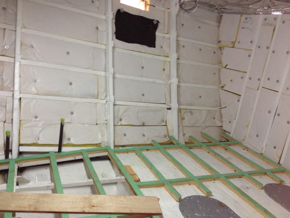 a white and green construction site aboard CALLISTO Yacht for Sale