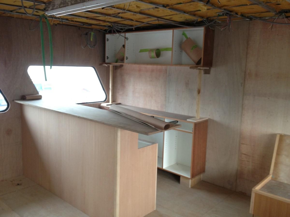 a room with a shelf and a shelf with objects on it aboard CALLISTO Yacht for Sale