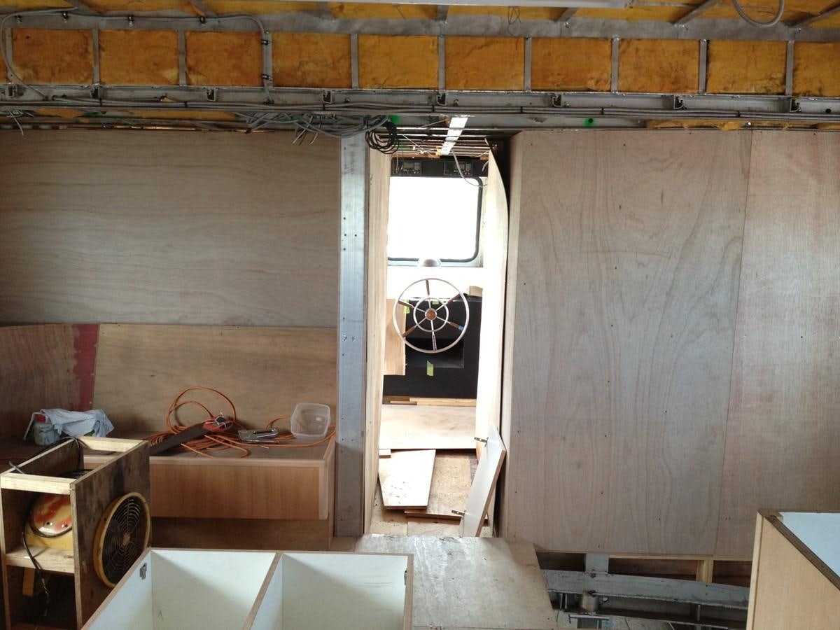 a room with a window and a fan aboard CALLISTO Yacht for Sale