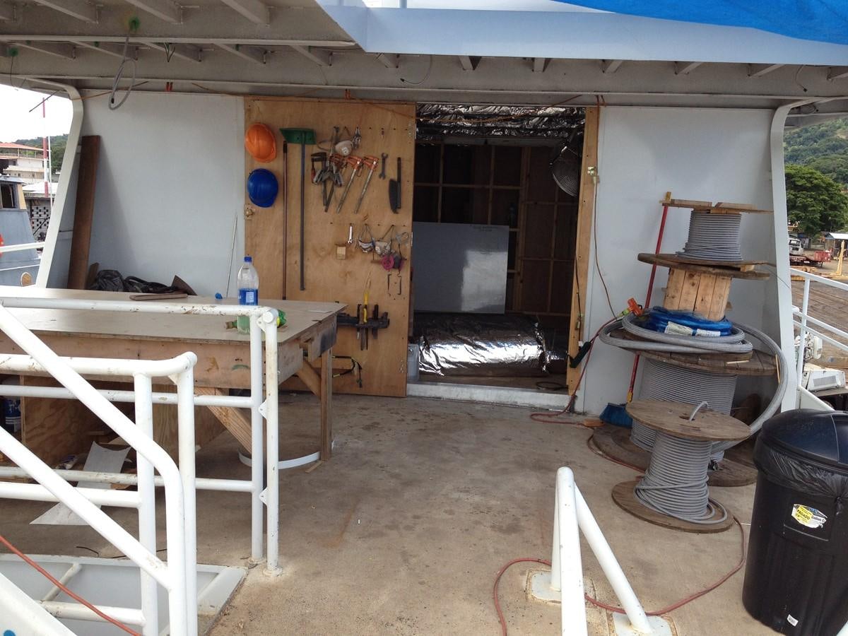 a room with a table and chairs aboard CALLISTO Yacht for Sale