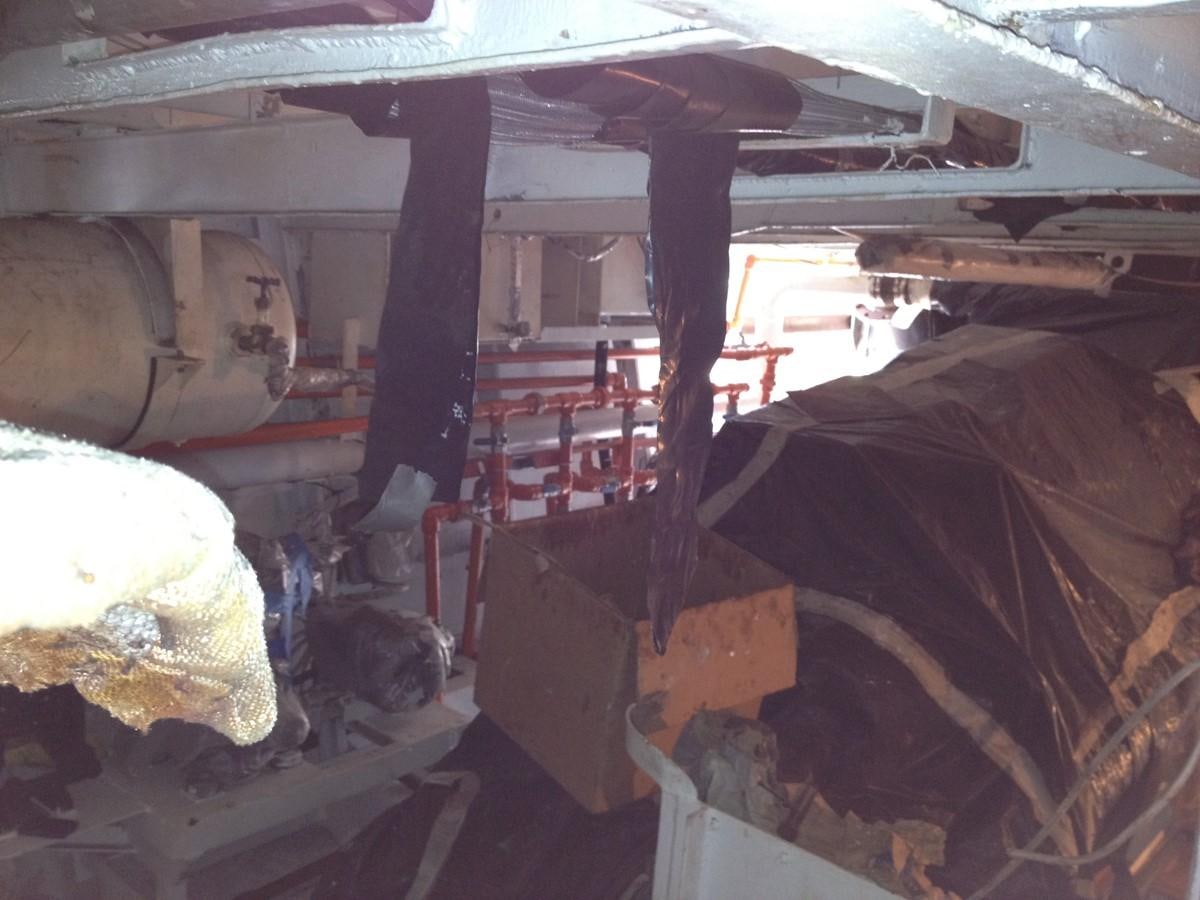 a room with a large pile of wood and debris aboard CALLISTO Yacht for Sale